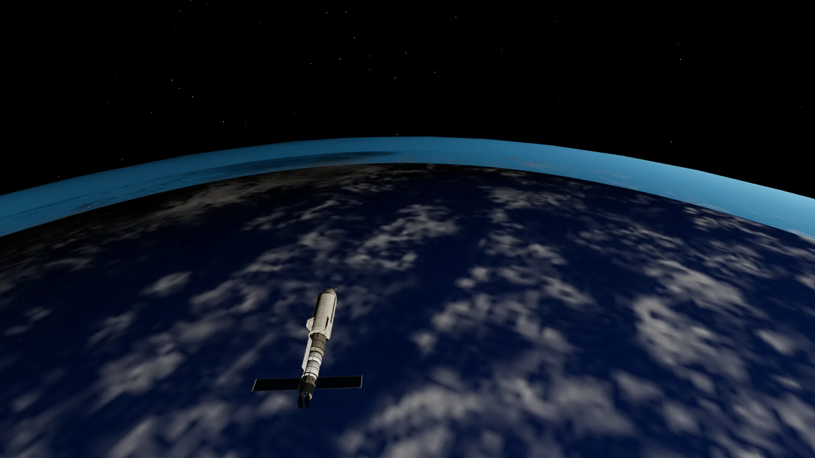 Earth filling the window as the shuttle falls toward its perigee, with the curve of the atmosphere lit along the limb.
