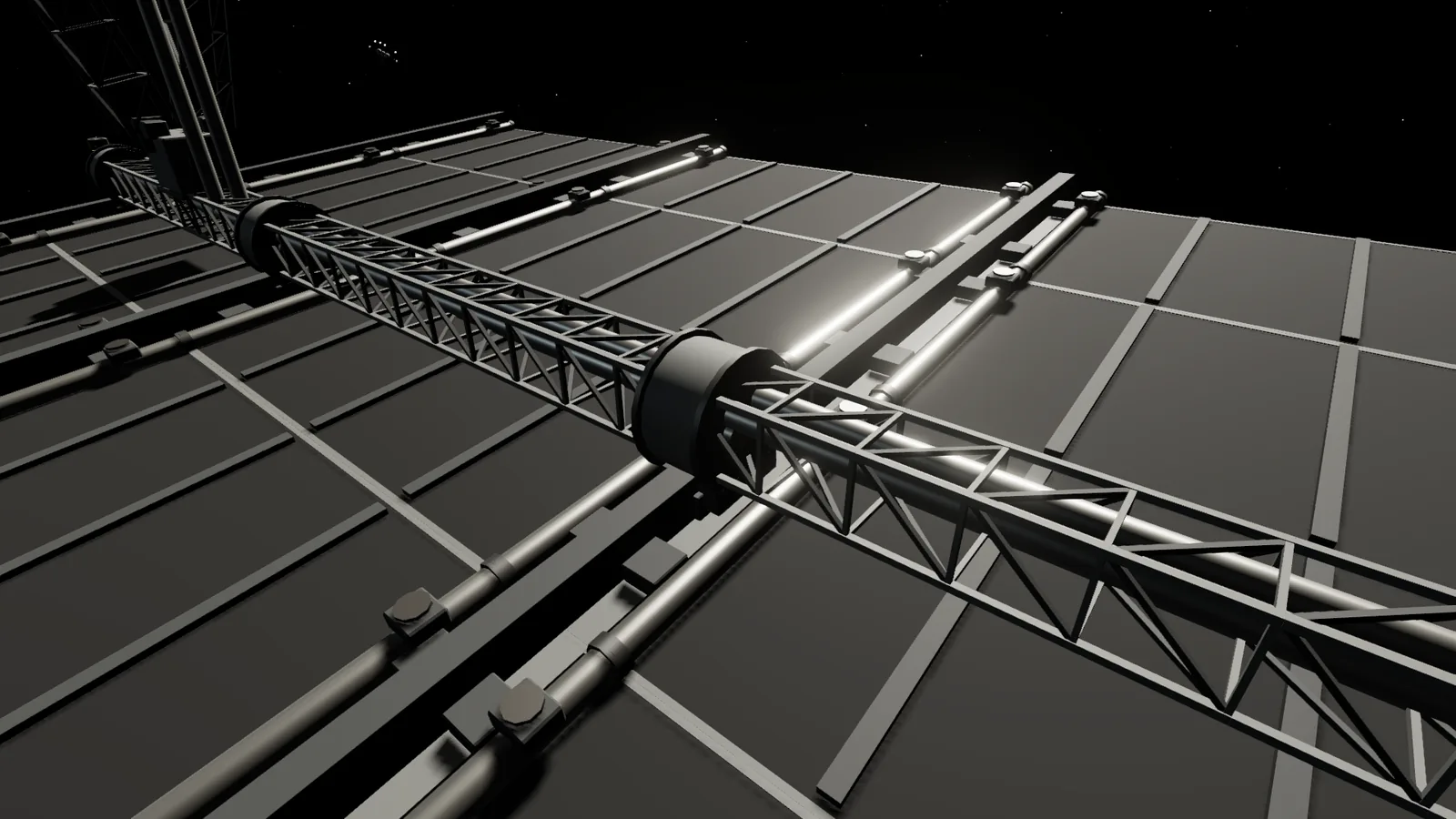Close under a radiator bank: a truss spine and hinge with parallel headers running across the dark panel backs.