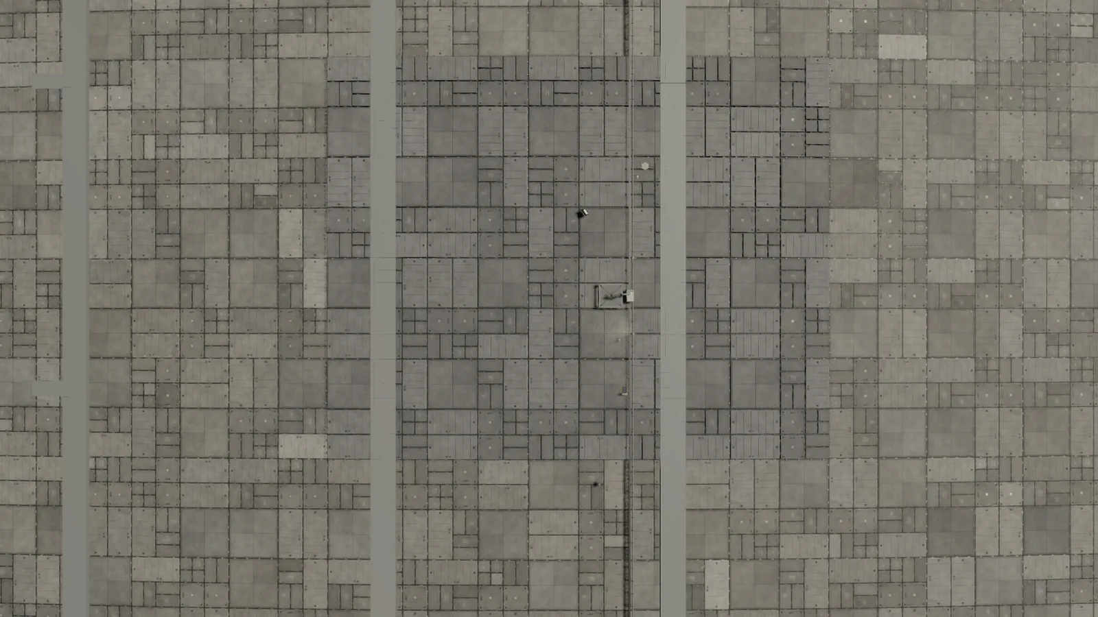The hull close up: a patchwork of shielding cassettes of several sizes between raised ribs, each one a replaceable tile.